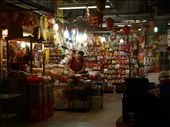 The owner of a spice stall in the famous Chinatown Wet Market prepares to welcome customers for the day. The market services the central district of Singapore, and stocks up everything from Oriental to Middle Eastern.: by sharonfoong, Views[527]