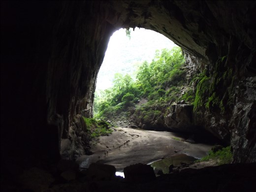 Trekking out of Hang En cave. Swapping one cave for the world's biggest cave.