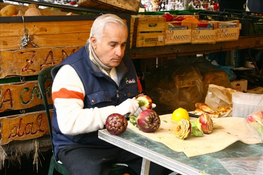 An elderly man cuts up artichokes, a popular food among Romans.  I watched as he spent hours deligently, quietly perfecting their shape.  I supposed he took much pride in his work, a trait we can greatly admire.
