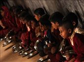 Students line up and eagerly wait for the day's special lunch. In this and many other nearby villages, residents are lucky to receive one meal of rice a day, and thus malnutrition becomes a major issue, especially to kids.: by shawnpittman, Views[610]