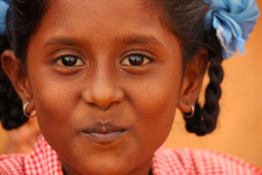 This is Yogastine, a local orphan girl preparing for a school picture day. For some kids in the villages, their families simply do not have enough to provide for them. Yogastine and her sister were recently sent by their family to a nearby boarding home run by a local charity so they could be taken care of. The girls now live just below the mountains, about an hour away from the villages, with 20 other kids where they receive food, clothes, schooling and more.