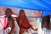Out of 2,606 individuals temporary residing in the evacuation center, Friends May Beth and Daniella (Left-Right) smiled as they saw me take their photo while they were roaming around the ‘village’, passing through ropes, hanged clothes, and large sheets of tarpaulin, during their spare time to find and play with some friends.: by shelterbox, Views[595]