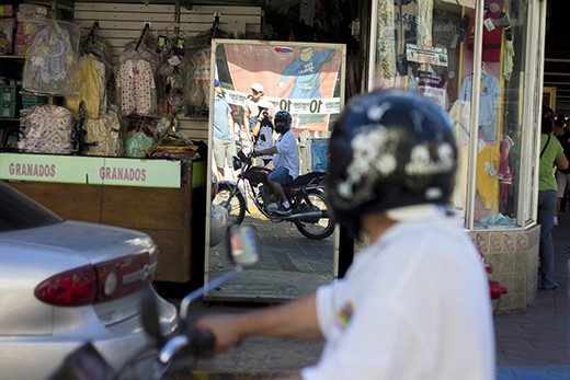 Is it consciousness, curiosity, or both? The man with the bike turns to see what I am photographing, soon to find that it is he.