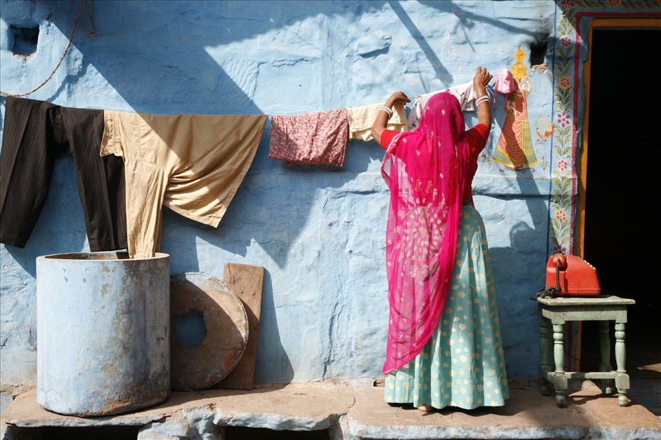 Hanging with the High Life...

I captured this lady tending to her washing on the tiny main strip of Hampi. Of an evening, her step out onto the street would be greeted to a populous sprawl of locals curled up with their families and blankets caring for their goats. 