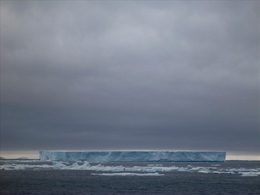 NOT ALL CHANGE IS GOOD - 

It's like a gunshot in pin drop silence when the ever calm atmosphere of Antarctica is shredded apart every now and then these days when large chunks of ice break off into the water. Although billed as a natural phenomenon by scientists, day by day, the rate at which the ice is breaking now is counter productive as there is little to no time in recovering that lost ice before the next big 'break'. What I've captured here is a part of the Larsen B ice shelf that broke off in 2002, which is one of the largest break offs known to recent humankind. Experts suggest that this was due to series of warmer summers in Antarctica and that, is a clear heads up to Climate Change.