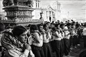 A group of men struggle under the weight of a saints' effigy as they carry it through the streets of Cusco and around the Plaza de Armas, during the festival of Corpus Christi.  They will do this all day and into the night when they will store the effegies until morning in La Catedral, a Spanish colonial cathedral, which you can see behind them.  Celebrated exactly nine weeks after Easter, it is a ritual co-opted by the Spanish in the 16th Century to Catholicize the Incan people.  The effigies are treated as living beings in a similar way as the Inca paraded their ancestors' mummies around that same plaza centuries before.: by shirak, Views[786]
