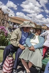A couple enjoy the day at the Plaza de Armas with their daughter during Cusco Carnival or Cusco Week, when there are daily processions in the Plaza de Armas, the central plaza in historic Cusco.  : by shirak, Views[477]