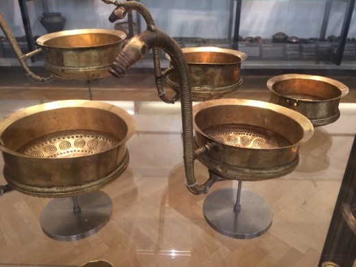 The collection of early golden bowls with horse handles in the National Museum.