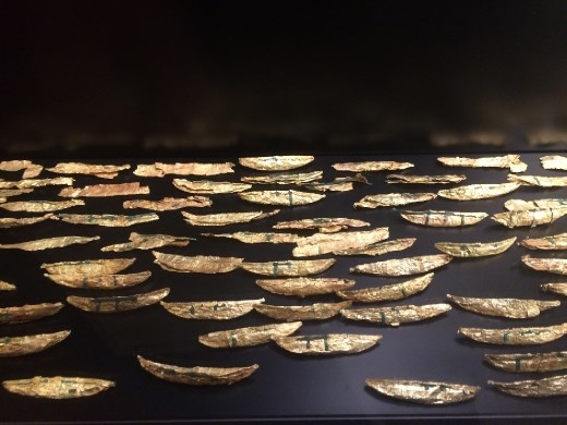 Tiny boats made from gold leaf. Like so many other items they were discovered in a bog.