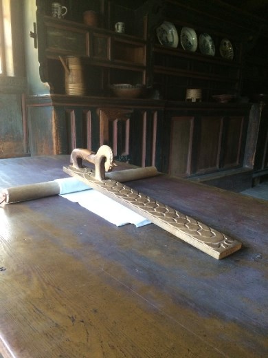 A wooden cloth roller and engagement gift. 