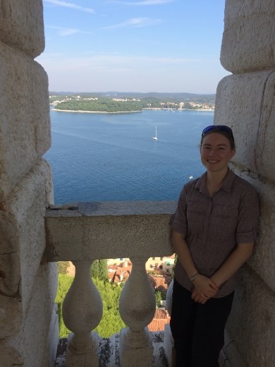 At the top of the bell tower with the see below. 