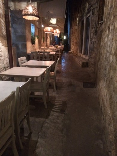 A typical restaurant setting on a narrow street!