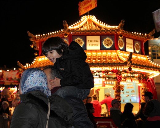 While waiting for our ride, I noticed this little boy sitting on his dad's shoulders keeping his ears warm! Magical Father Son moment
