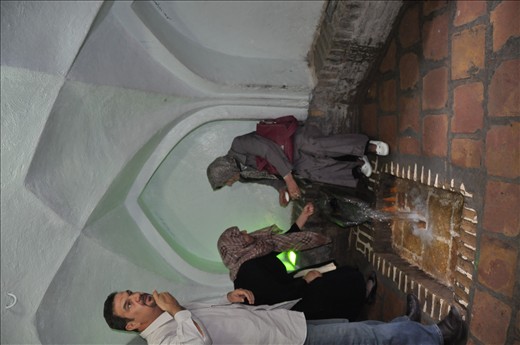 3 pligrims wash their hands&faces with holy water for curing their illnesses