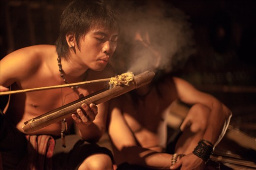 Tribesmen at the Mari Mari Village relive the traditions of their ancestors by lighting a fire without naked flames.  Kota Kinabalu - Borneo, Malaysia.