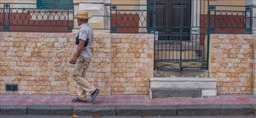 man on sidewalk middle of the afternoon in the quiet town on Santa Teresa