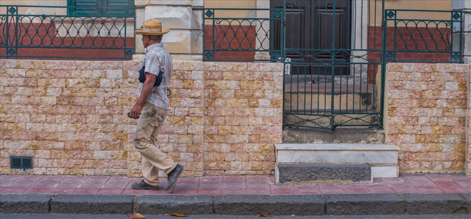 man on sidewalk middle of the afternoon in the quiet town on Santa Teresa