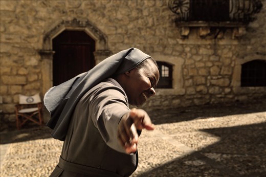 Angel is smiling at me on the streets of Sicilia, before the ritual.