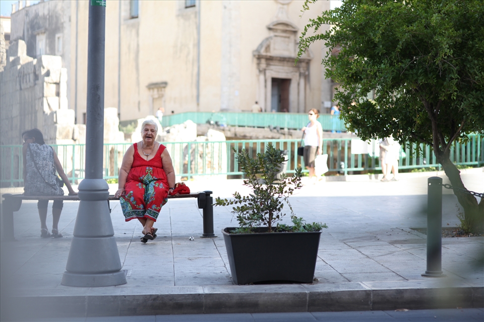 Woman in Sicily. Smoking. Watching. Waiting for nobody, for nothing. Thoughts.