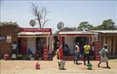 I met Happy in Chitimba village in the northern part of Lake Malawi. He was born in Lilongwe but moved to Chitimba and owns this corner shop where he sells cold drinks and snacks to the locals. As the village is close to the Tanzanian/Kenyan border, he also services people trading over the border. Not much goes on in the village, so you can see locals hanging around the shop and kids watch soccer on the TV in Happy's shop.: by simbolism, Views[480]