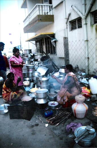 As they start cooking, the smell of the street food escapes into the air