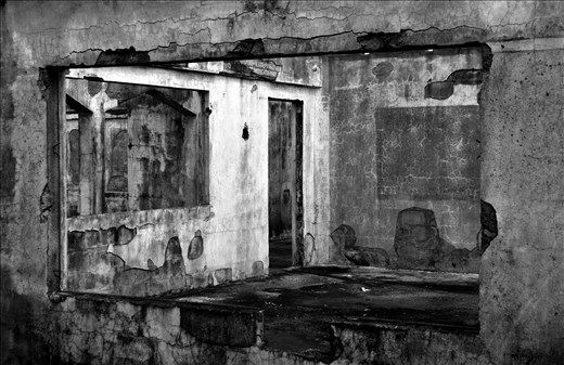 The arson-scarred ruins of Naria Primary School- a relic and reminder of Fiji's racial tensions. The school was burned down in 1987 and again in 2000, each time on the night following a government coup. Fiji was a British colony for almost 100 years, and the indentured Indian laborers that the British brought to work in the sugarcane fields still have descendants in Fiji. However, tensions between the Native and Indo-Fijians are thinly veiled, as Naria Priimary School stands as a testament to. The school was torched because it was built on native Fijian land but the students were primarily Indo-Fijian. 

Naria Settlement, Viti Levu, Fiji. 