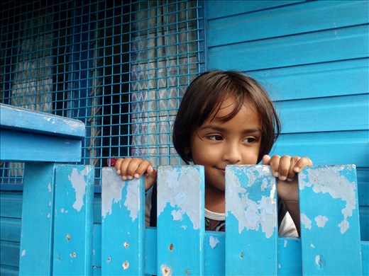 4-year-old Priti hides a smile during an informal English lesson on her porch. 

Lakena Settlement, Viti Levu, Fiji. 