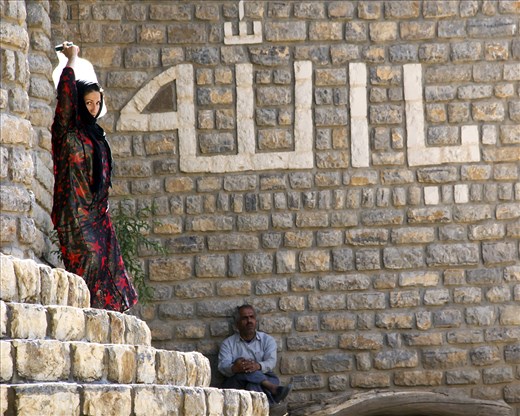 I was photographing a man  that suddenly a woman with a bowl of water get out of the door of the mosque.
The village's only source of drinking water is in the village mosque.
Like most women in the world as women in Kurdistan are responsible for housekeeping duties.

 