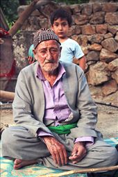 A portrait of two generation
kurdish. The grandpa was smoking and grandson was playing football.: by sinbadsialor, Views[325]