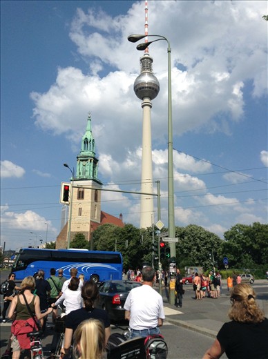 The Berlin TV tower the city's tallest landmark and the steeple of Berlin's  oldest functioning church Marienkirche