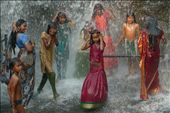 Women and girls bathe in a gender-segregated waterfall south of Trivandrum. For the sake of modesty, women stay clothed even while bathing.: by skydiva74, Views[20199]