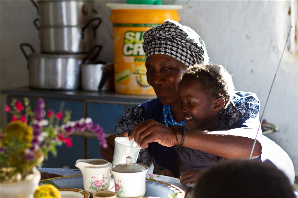 Gertie making tea with her granddaughter