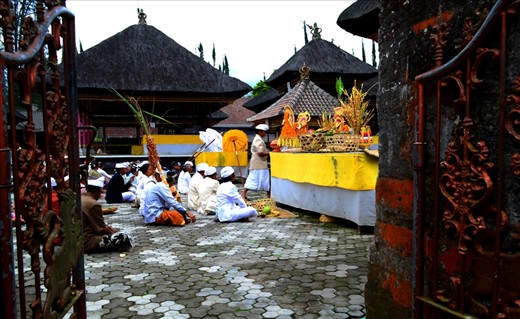 some people are doing bali religious procession at the temple is customary procession to commemorate the death of a family member. Religious leaders are leading the sacred procession, all participants wore traditional Balinese. Unfortunately the general public (tourists) are not allowed to enter the temple especially when one is implementing a prayer. However, visitors can witness this procession from outside of the temple, and it can also perpetuate the camera, as far as it does not interfere the religious processions.
