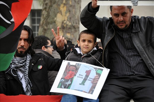 A son and his father protest in front of the Embassy in Westminster.