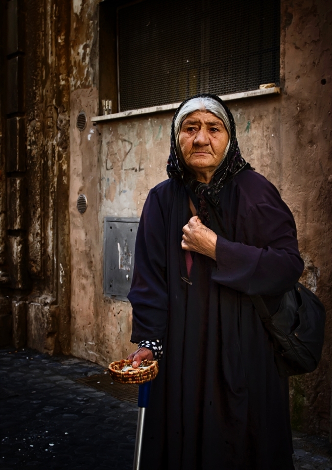 Rome Beggars:  Everyone warns you of Gypsies and con artists, but it is hard to turn your back on people who are begging because they have little choice.