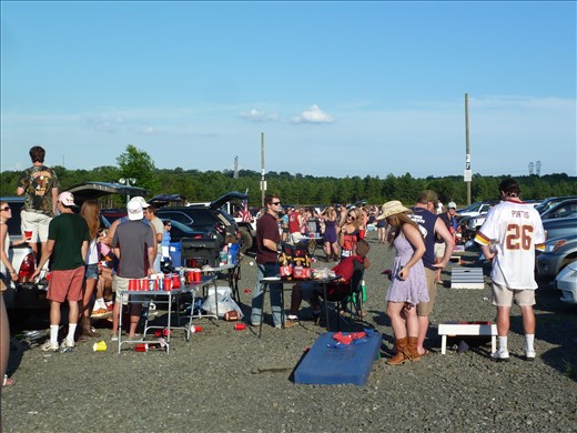 Parking lot party complete with corn hole. I wish we did this at home!