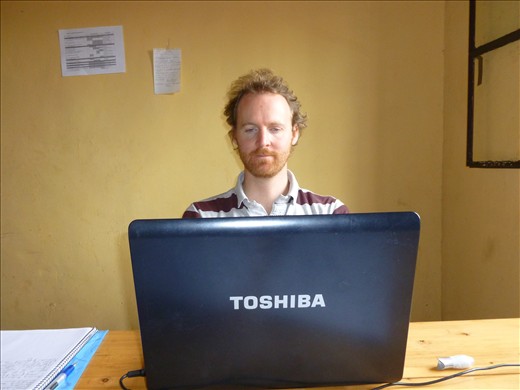 Rwanda! Our new office at REDO - Simon has turned in to a pygmy