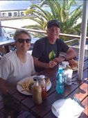 Late lunch of hake fish and chips for John and ostrich burger for Denise.  Little spot at the harbor at Simons Town on day's drive to Cape of Good Hope.: by smithtravel, Views[209]
