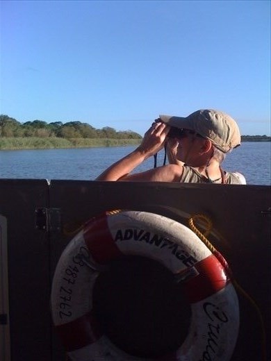 Denise as a hood ornament on the Croc and Hippo cruise in St. Lucia.  The best way for her to get to see around the crowd on the boat.