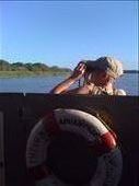Denise as a hood ornament on the Croc and Hippo cruise in St. Lucia.  The best way for her to get to see around the crowd on the boat.: by smithtravel, Views[702]