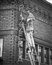 Putting up the sign for the new bussiness that was in town. : by snap12, Views[217]