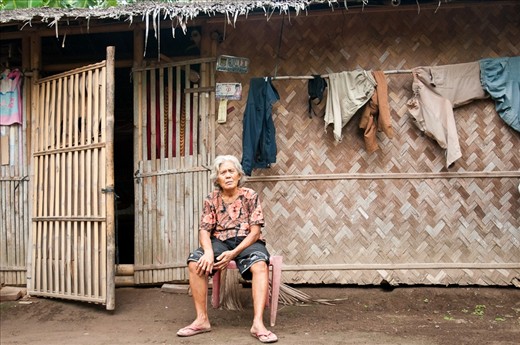 The women sit in front of her house in Teluk Naga, Tangerang, Indonesia. This women is the part of Indonesian society which is call as “Cina Benteng”. Cina Benteng is a community that is a mixture between Chinese and Betawi, Melayu or Sunda. 