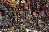 A merchant crouches amongst his wares at Swayambhunath (a.k.a. The Monkey Temple), Kathmandu's most popular tourist attraction. : by sofagis, Views[1279]