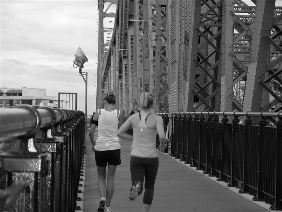 Jogging on the Story Bridge, Brisbane City, January 2013.
The Story Bridge is one of the main symbols of the city and offers a stunning panorama of its skyscrapers. This Bridge crosses the river in one of its tightest passages, Kangaroo Point, connecting the North side of the city, with the Southern suburbs. A Kangaroo's tail is hiding in the city's landscape and you may spot it if you go for a  jog along the Bridge.