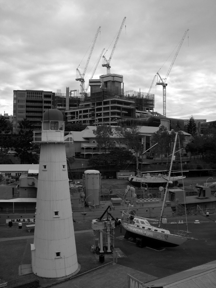 New buildings are rising behind the Maritime Museum, Brisbane City, January 2013.
Cranes are a visible landmark. They shape the urban panorama of the city pointing to the sky. Will we touch it one day?


