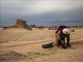 Our guide Eddie, never without his guitar and a song, shows us a fire pit with evidence of tools and bones of meals past, which has recently been uncovered by the winds.  The area hasn't been inhabited for about 20,000 years.: by sophiesiegelphotography, Views[230]