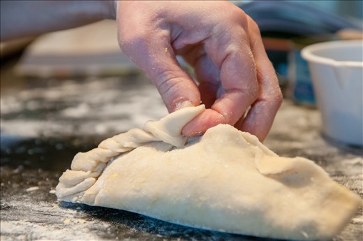twisting the seam of a salteña for that 