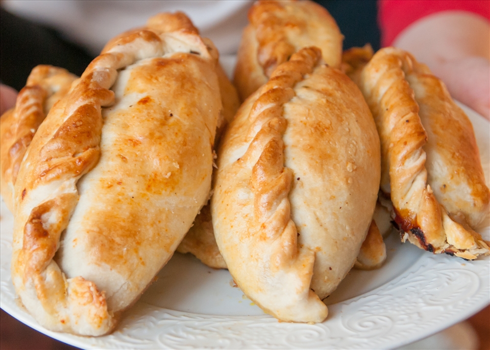 The salteñas right out of the oven, golden brown.