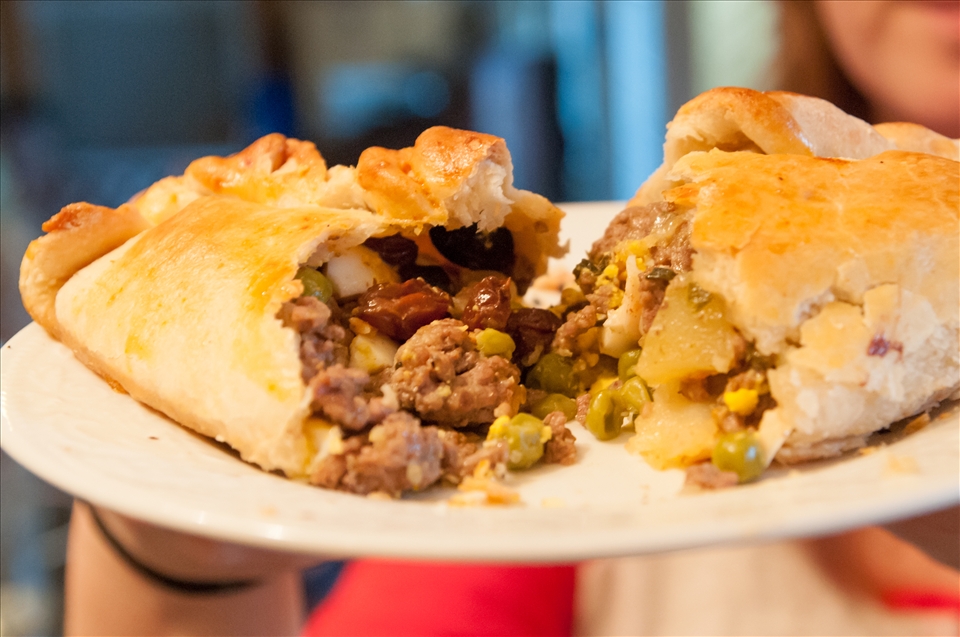 a delicious, steaming salteña, ready to eat! buen provecho!