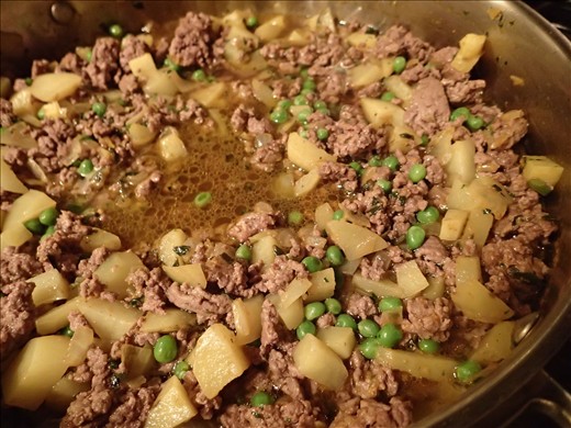 Filling mixture simmering with beef broth added